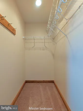 a view of empty room with wooden walls