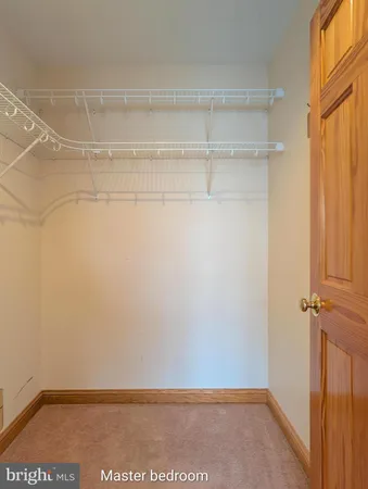 an empty room with wooden floor