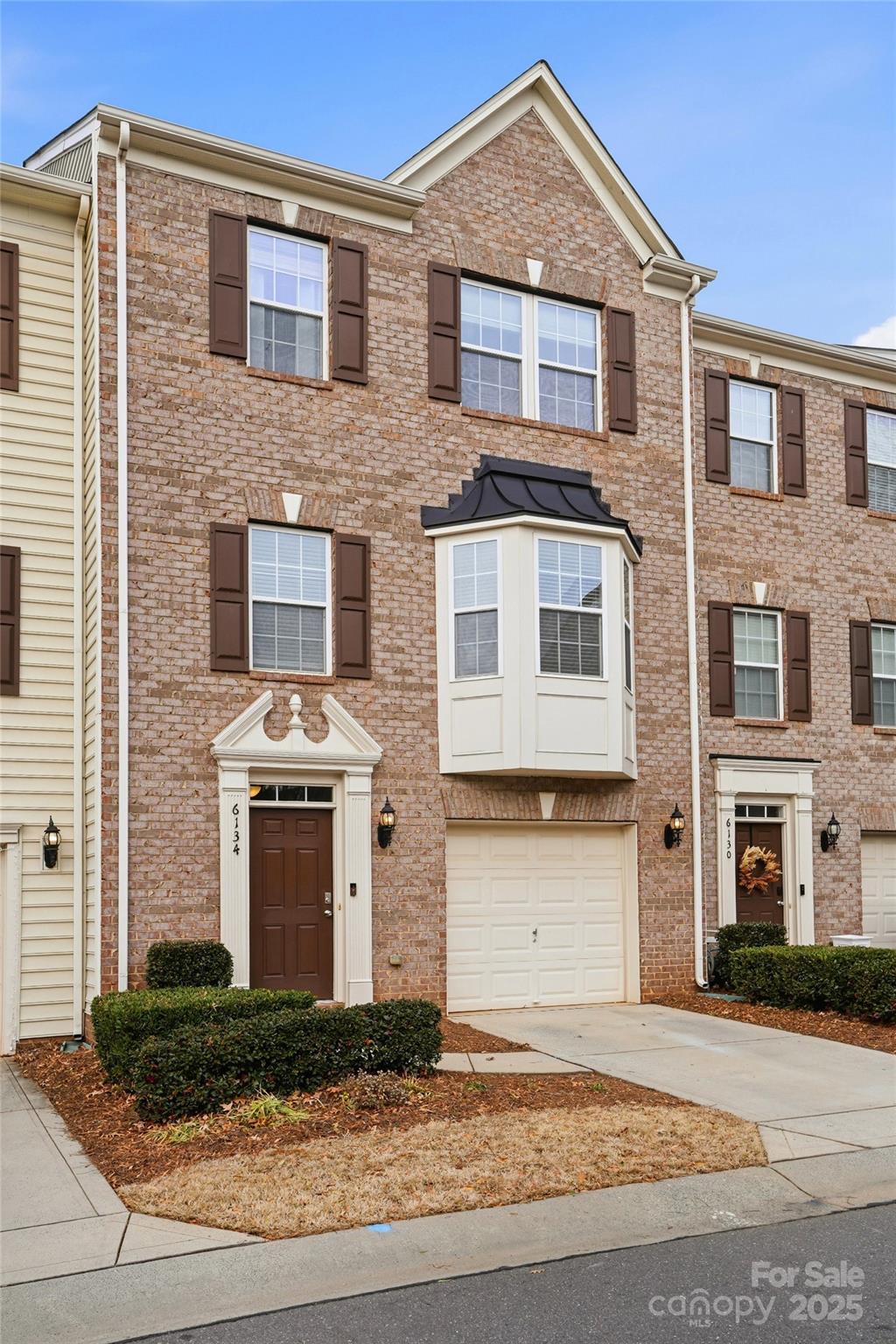 a front view of a house with yard