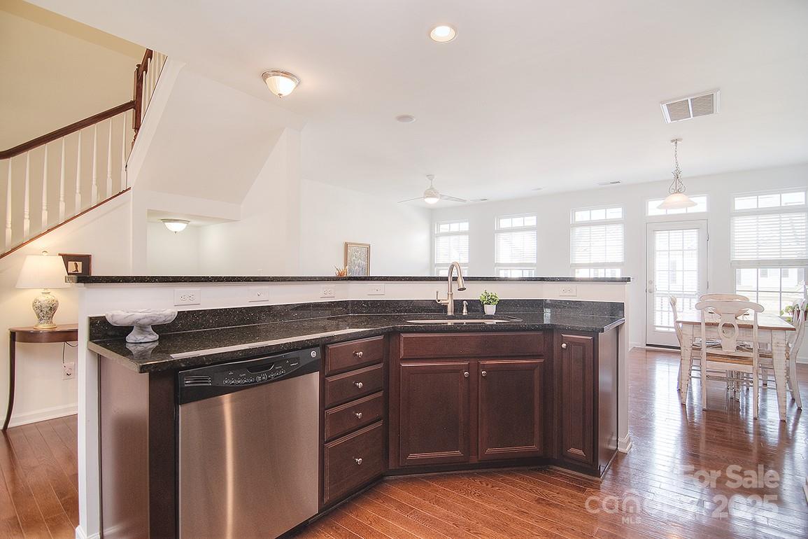 6134 Rockefeller Lane Charlotte, NC 28210 - Photo 12 of 47 a kitchen with a sink a stove and cabinets