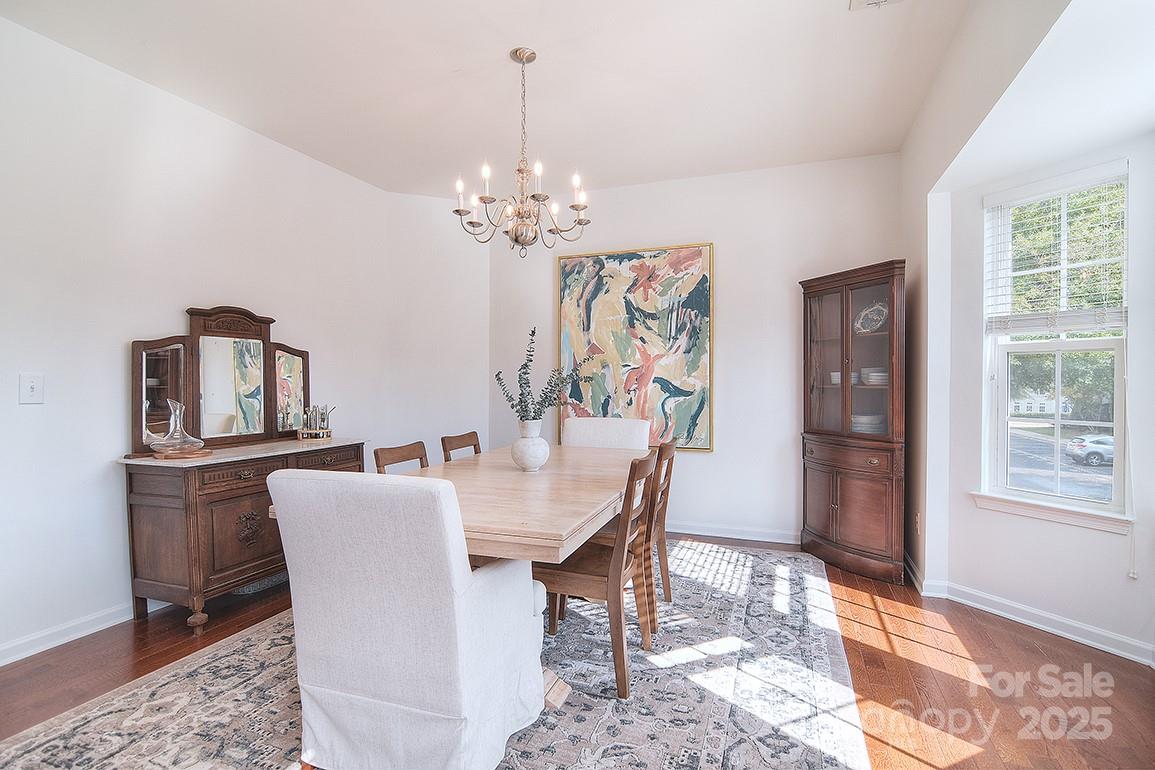 6134 Rockefeller Lane Charlotte, NC 28210 - Photo 18 of 47 a view of a dining room with furniture window and wooden floor