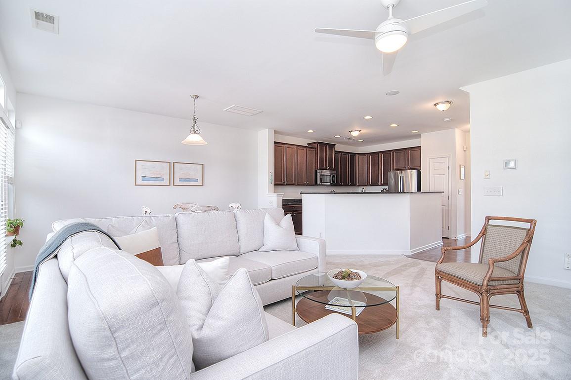 6134 Rockefeller Lane Charlotte, NC 28210 - Photo 21 of 47 a living room with furniture and kitchen view