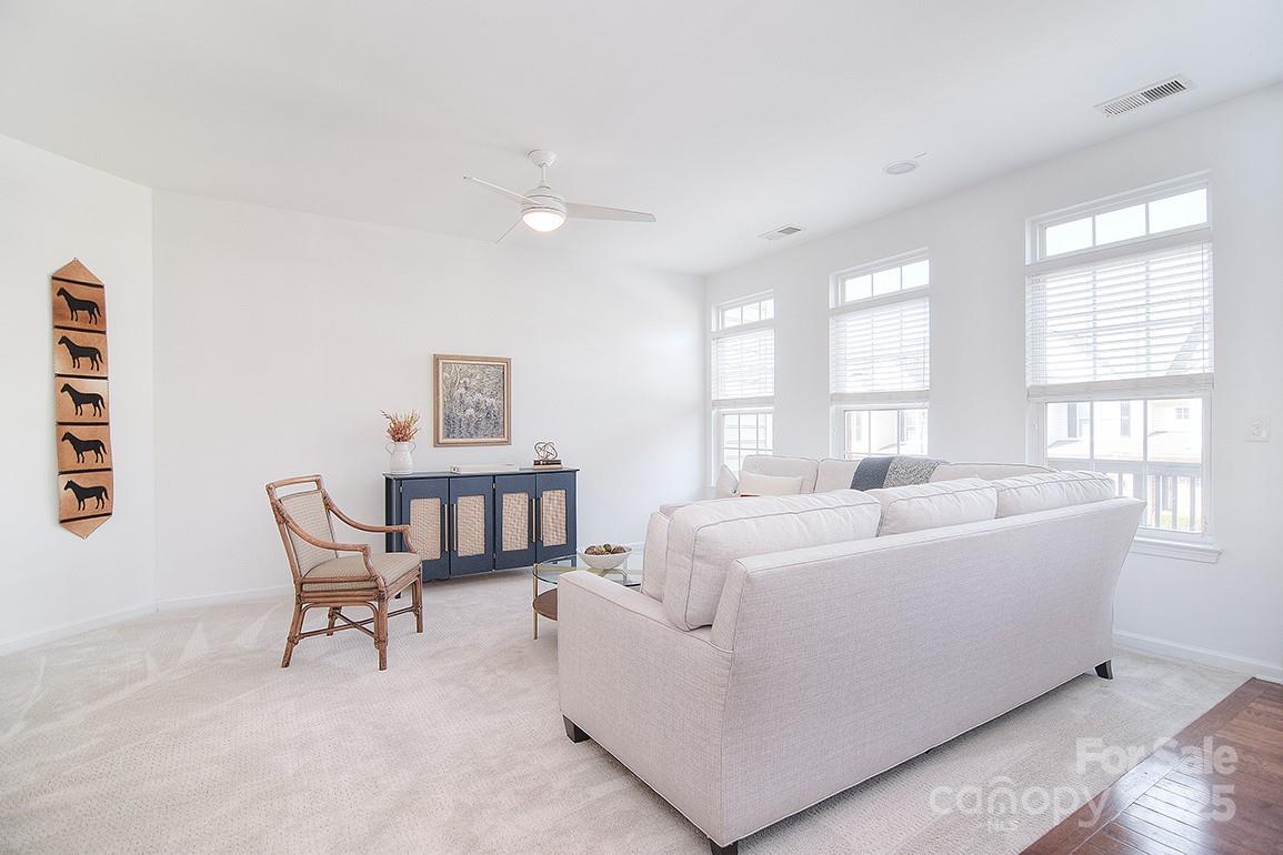 6134 Rockefeller Lane Charlotte, NC 28210 - Photo 24 of 47 a living room with furniture and a window
