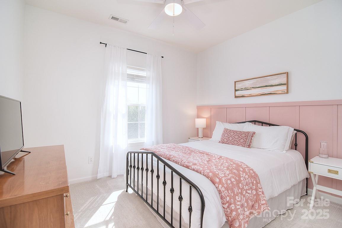 6134 Rockefeller Lane Charlotte, NC 28210 - Photo 27 of 47 a bedroom with a bed and a window
