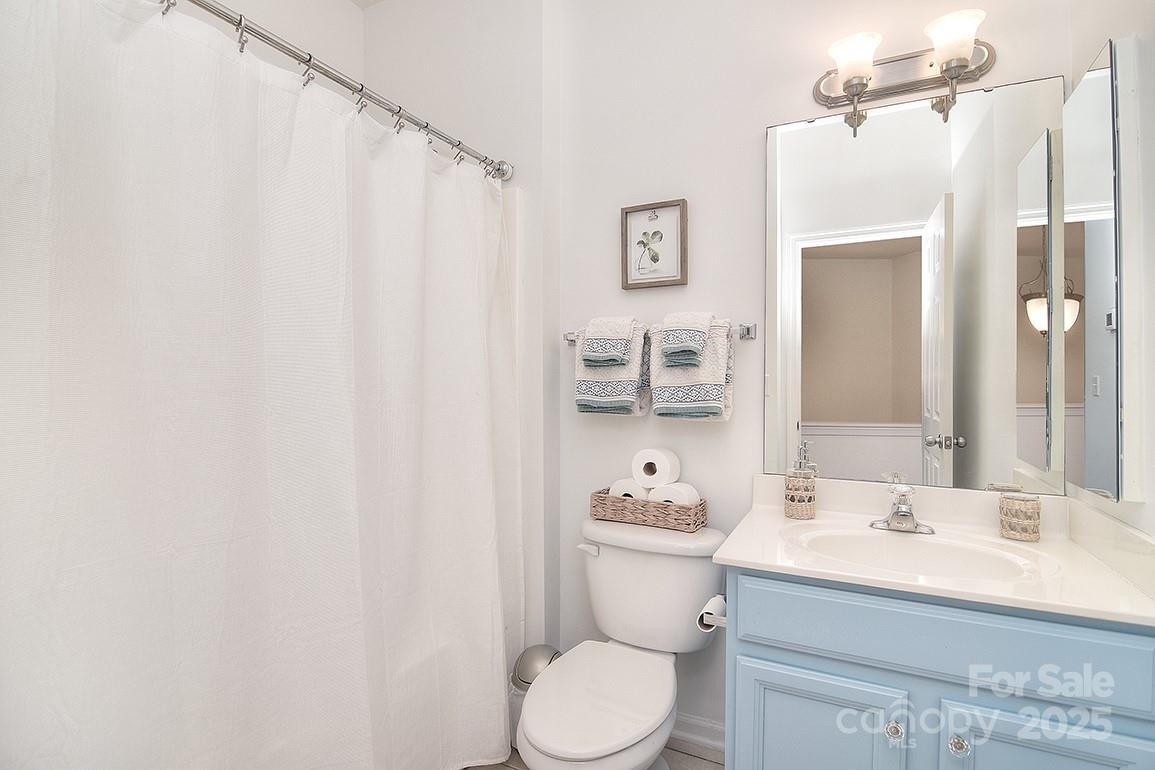 6134 Rockefeller Lane Charlotte, NC 28210 - Photo 29 of 47 a bathroom with a sink toilet and shower