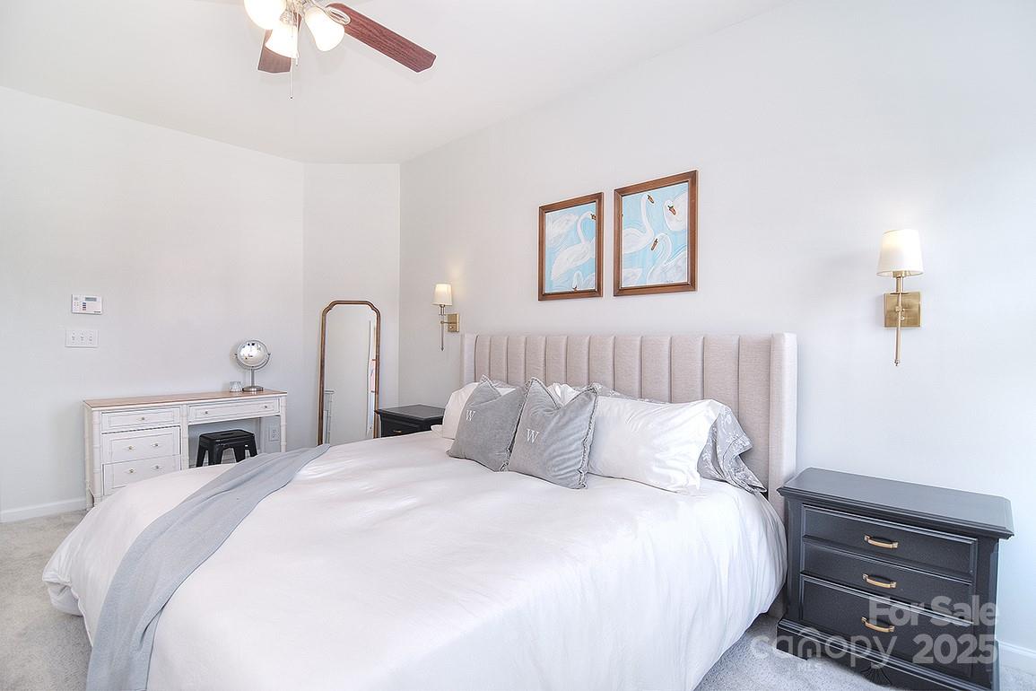 6134 Rockefeller Lane Charlotte, NC 28210 - Photo 31 of 47 a bedroom with a bed and a dresser