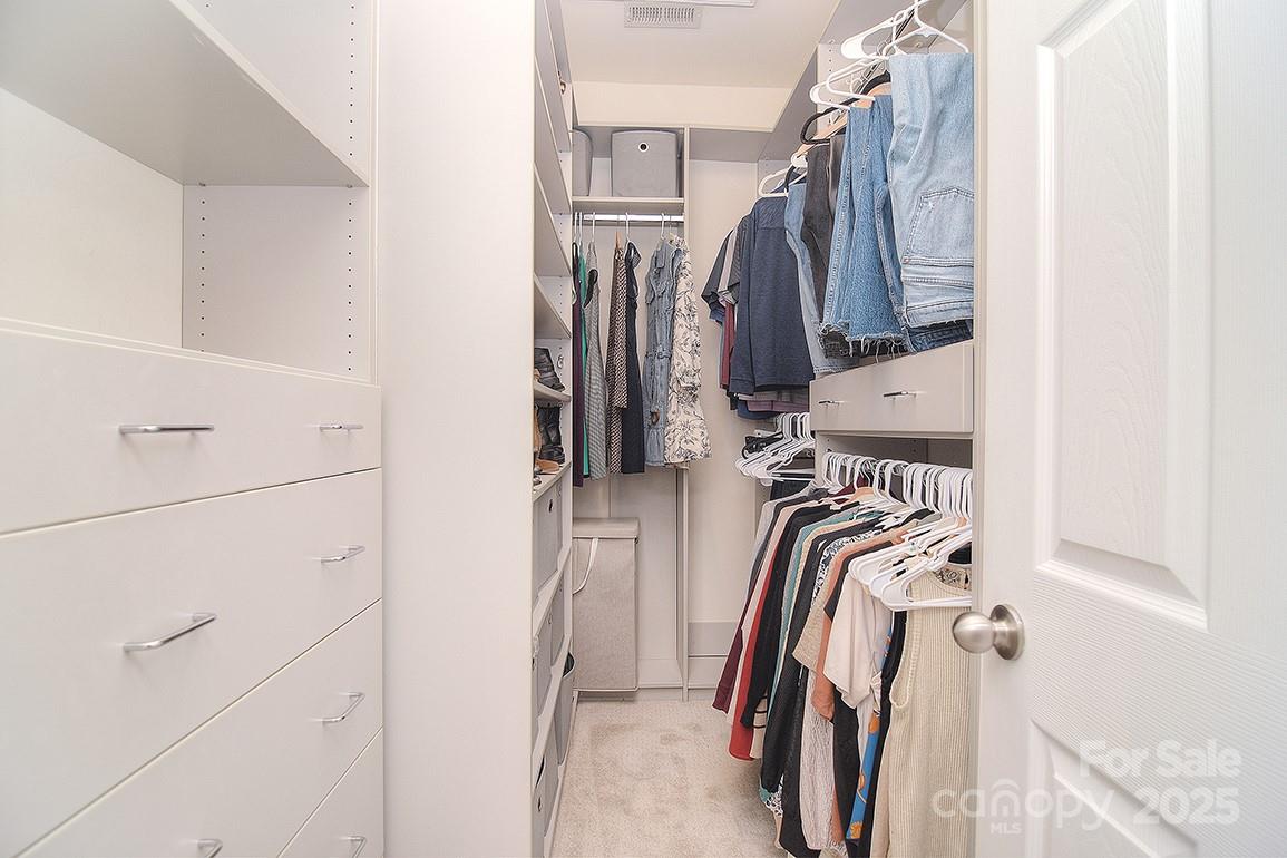 6134 Rockefeller Lane Charlotte, NC 28210 - Photo 33 of 47 a view of walk in closet with clothes and shoes