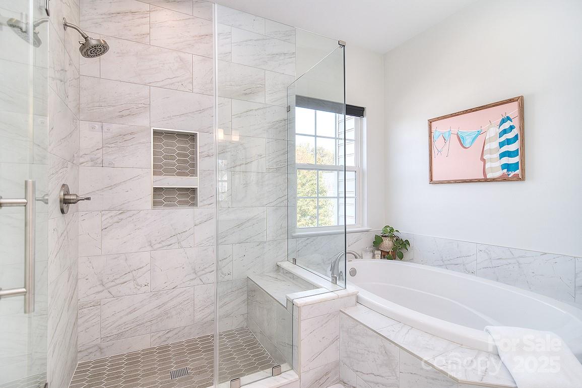 6134 Rockefeller Lane Charlotte, NC 28210 - Photo 35 of 47 a bathroom with a bathtub and a shower