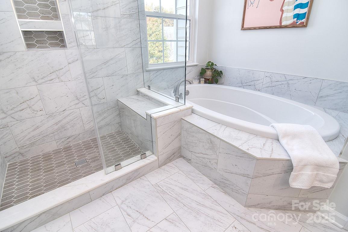 6134 Rockefeller Lane Charlotte, NC 28210 - Photo 36 of 47 a bathroom with a bathtub and shower