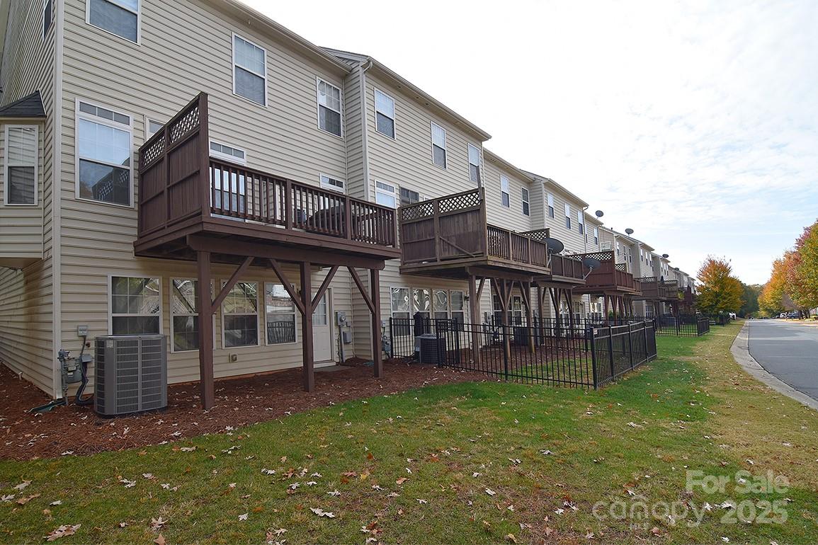 6134 Rockefeller Lane Charlotte, NC 28210 - Photo 38 of 47 a view of a house with a yard and sitting area