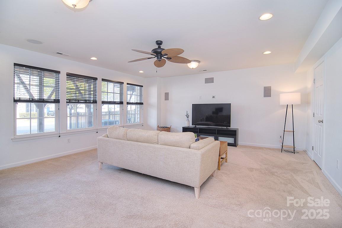 6134 Rockefeller Lane Charlotte, NC 28210 - Photo 4 of 47 a living room with furniture and a flat screen tv