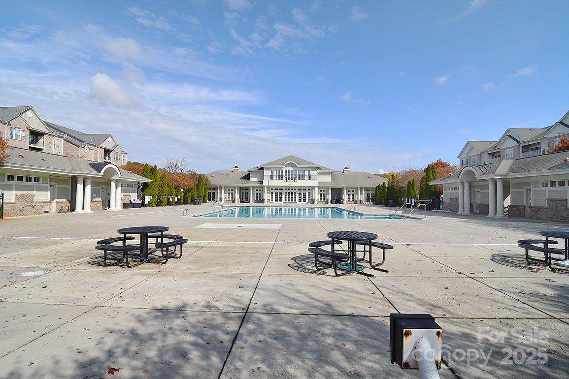 6134 Rockefeller Lane Charlotte, NC 28210 - Photo 43 of 47 a view of a house with sitting area and swimming pool