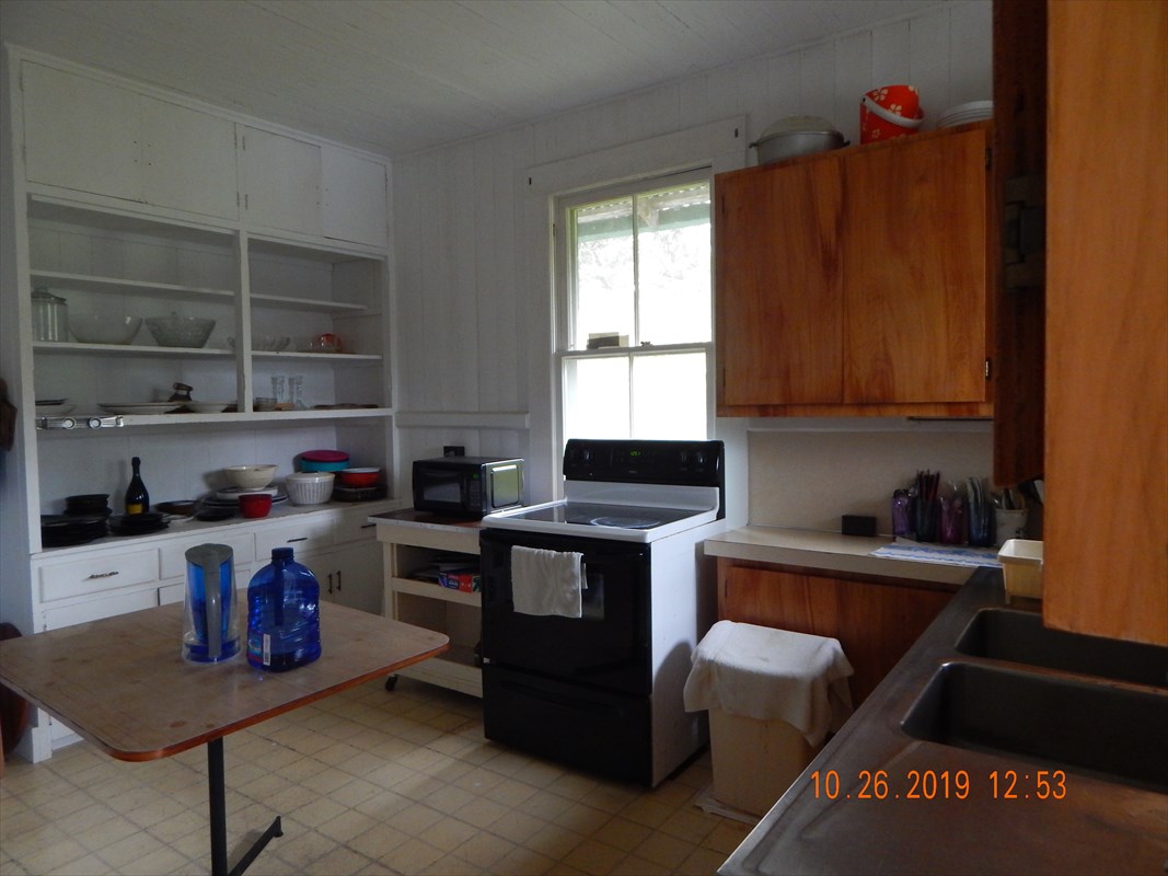 19-3941 Kilauea Road Volcano, HI 96785 - Photo 8 of 23 a kitchen with a cabinets and window