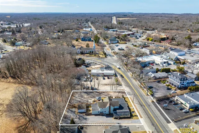 an aerial view of a residential houses with outdoor space
