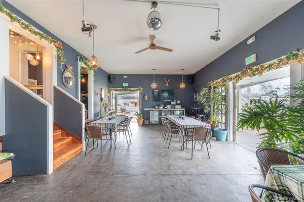 a view of a dining room with furniture window and outside view