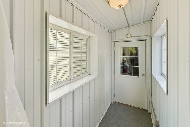 3100 Chicago Road Paw Paw, IL 61353 - Photo 14 of 26 a view of a hallway with windows