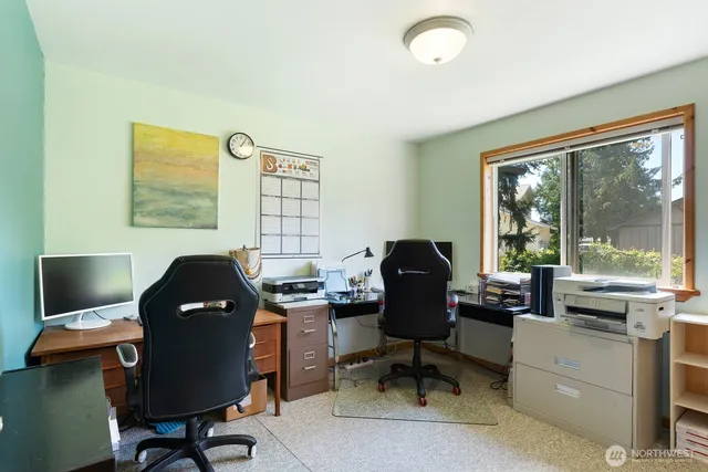 a work room with furniture and a window