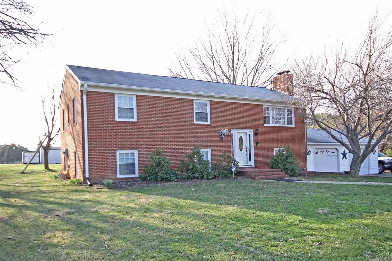 384 Bybee Road Louisa, VA 23093 - Photo 1 of 23 a front view of house with yard and entertaining space