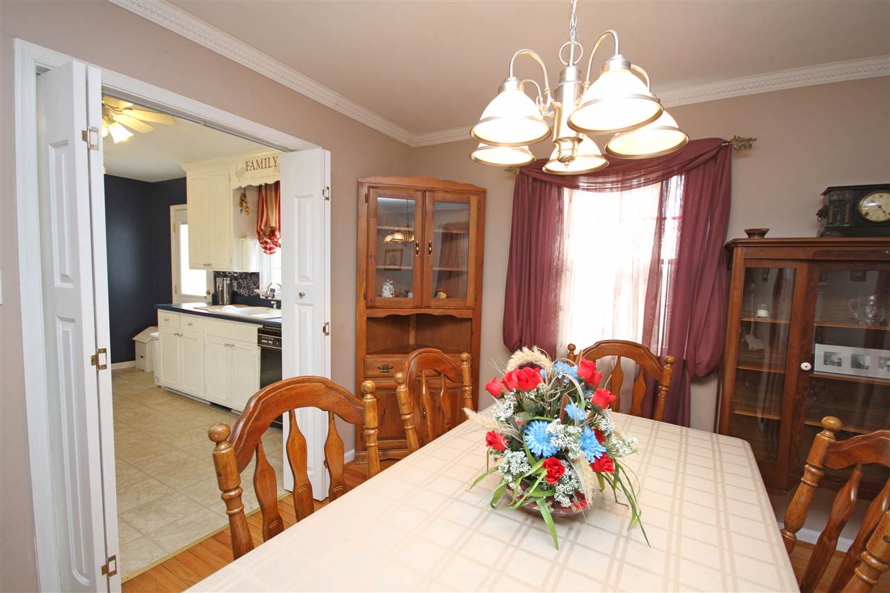 384 Bybee Road Louisa, VA 23093 - Photo 5 of 23 a view of a dining room with furniture a chandelier and wooden floor