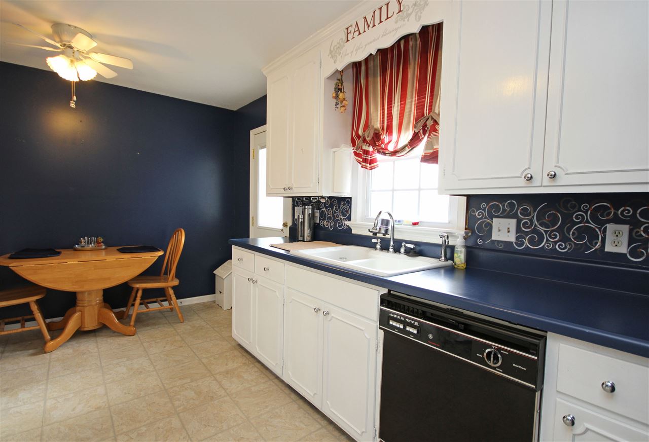 384 Bybee Road Louisa, VA 23093 - Photo 7 of 23 a kitchen with stainless steel appliances a sink cabinets and a window