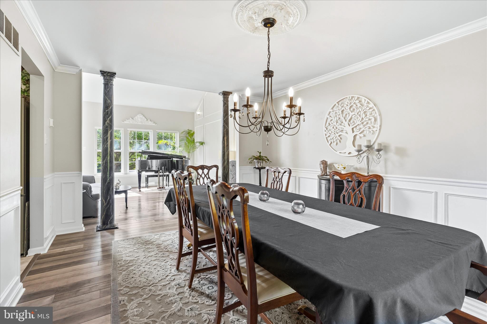 4114 Lomar Terrace Mount Airy, MD 21771 - Photo 21 of 91 a view of a dining room with furniture a chandelier and wooden floor