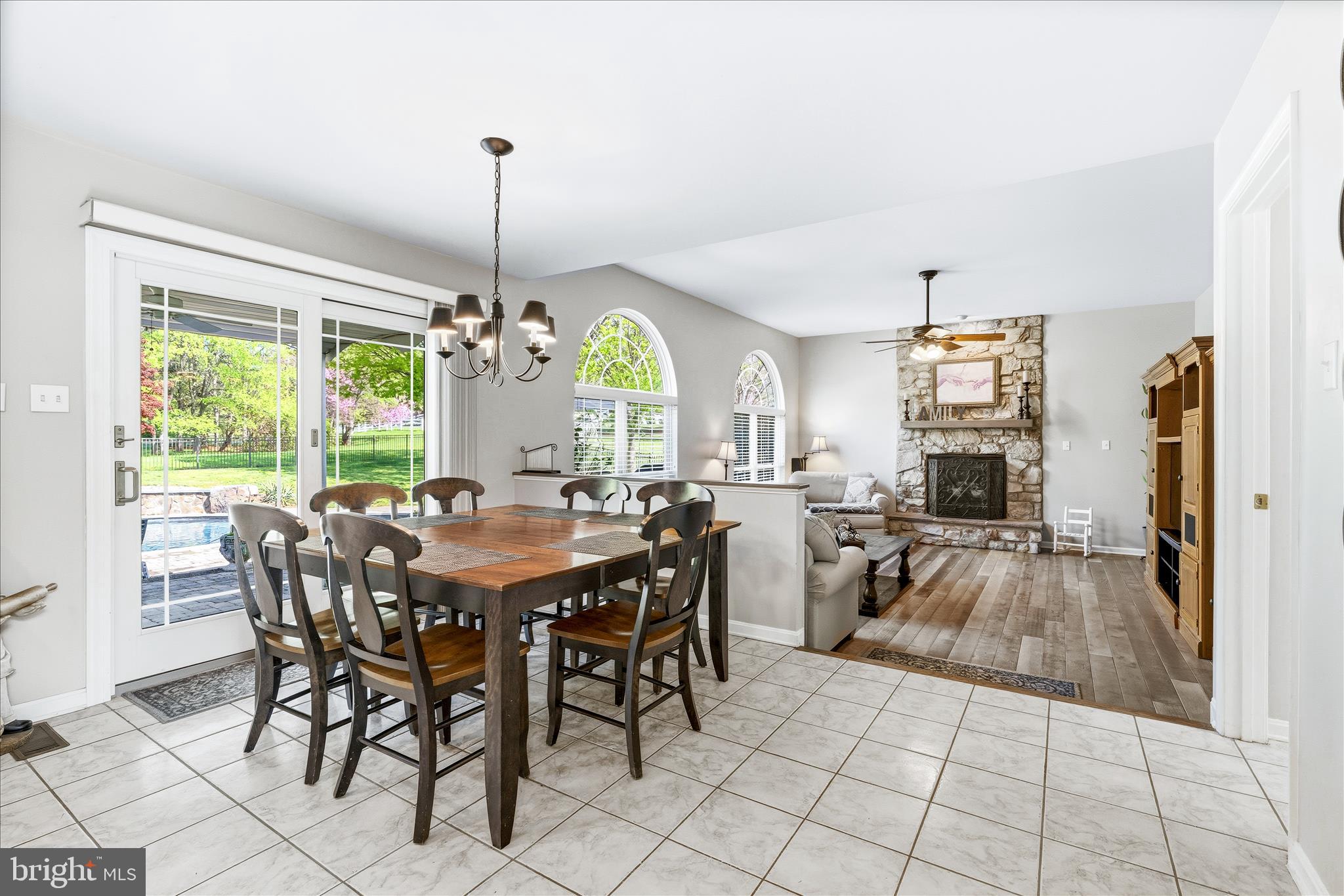 4114 Lomar Terrace Mount Airy, MD 21771 - Photo 27 of 91 a view of a dining room and livingroom with furniture wooden floor a chandelier