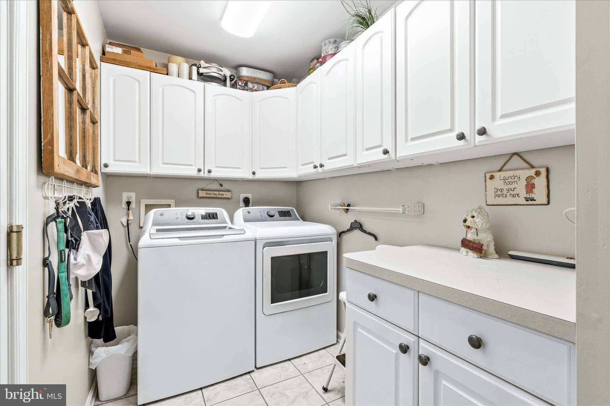 4114 Lomar Terrace Mount Airy, MD 21771 - Photo 30 of 91 a utility room with stainless steel appliances white cabinets and a sink