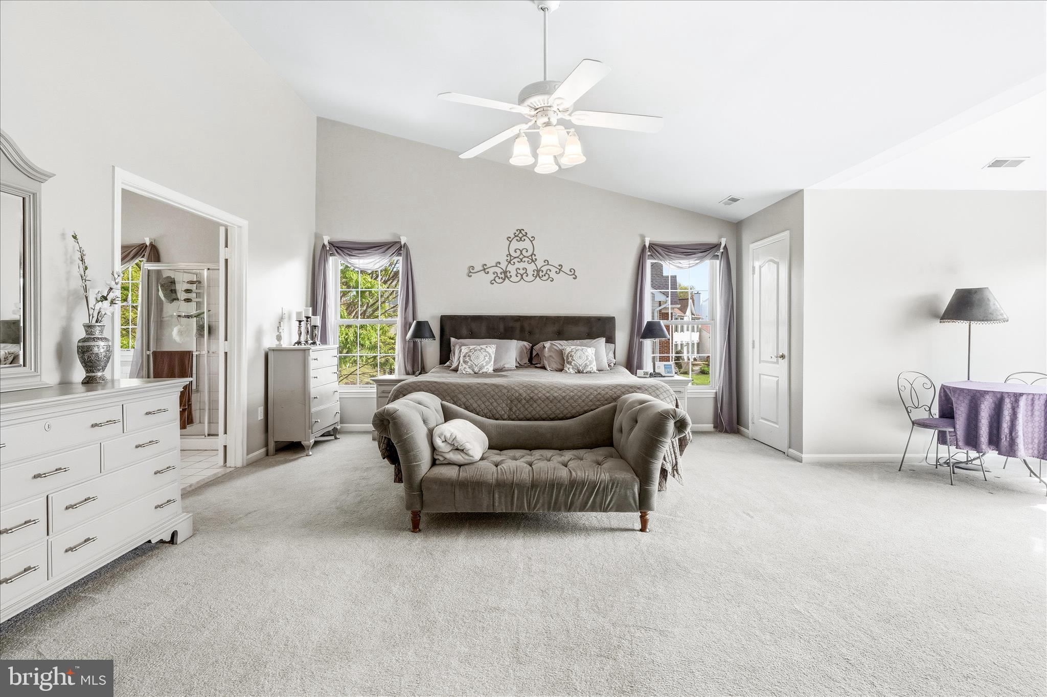 4114 Lomar Terrace Mount Airy, MD 21771 - Photo 35 of 91 a bedroom with a large bed and a chandelier