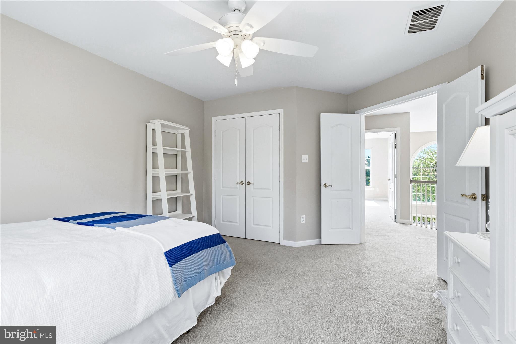 4114 Lomar Terrace Mount Airy, MD 21771 - Photo 43 of 91 a bedroom with a large bed closet and chandelier