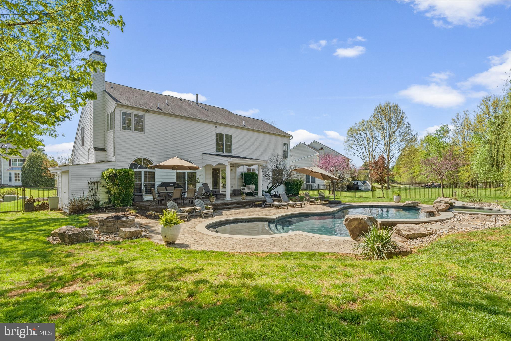 4114 Lomar Terrace Mount Airy, MD 21771 - Photo 67 of 91 a view of a house with swimming pool and a yard