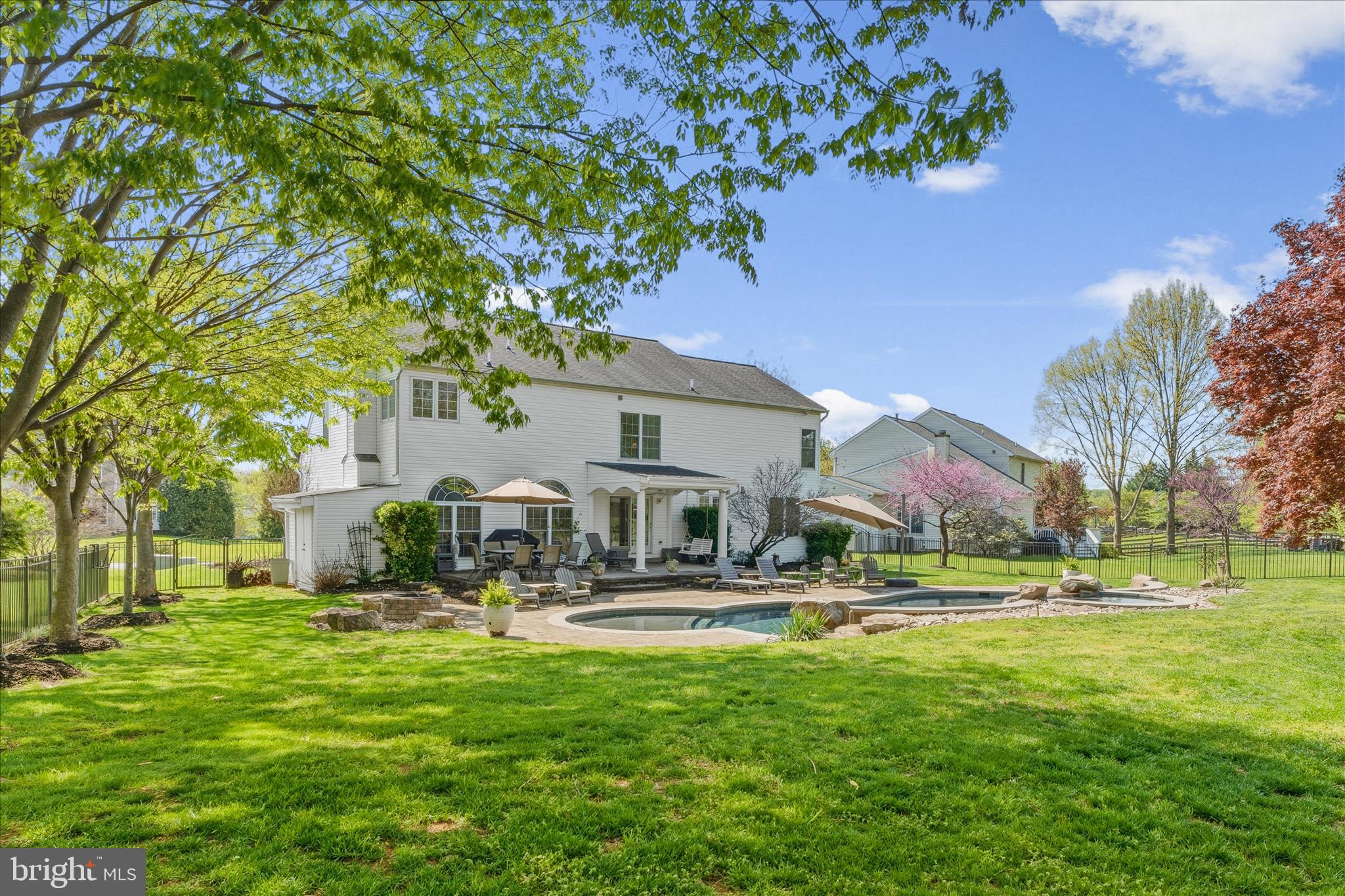 4114 Lomar Terrace Mount Airy, MD 21771 - Photo 68 of 91 a front view of a building with a garden and trees