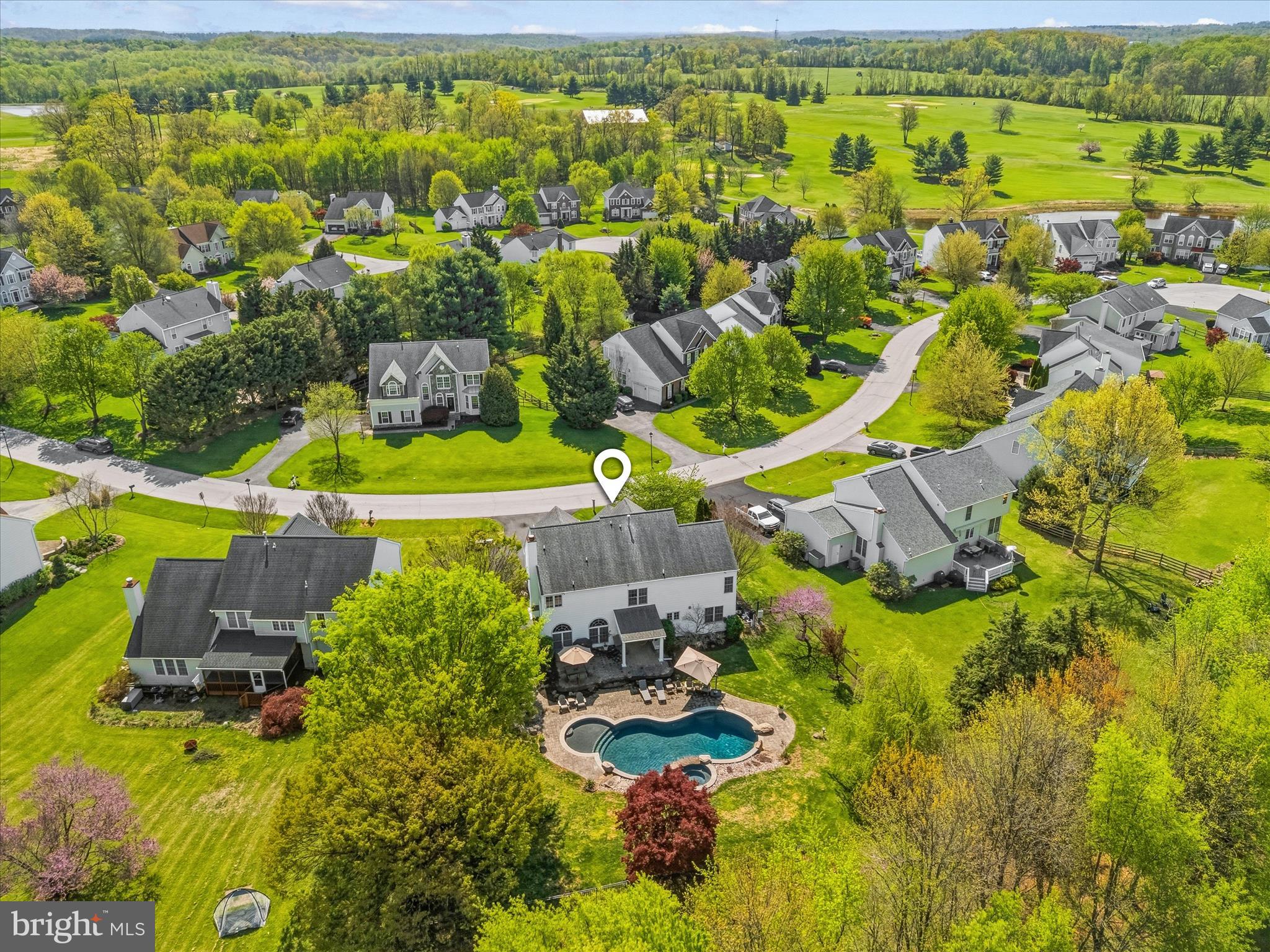 4114 Lomar Terrace Mount Airy, MD 21771 - Photo 81 of 91 an aerial view of residential houses with outdoor space and swimming pool