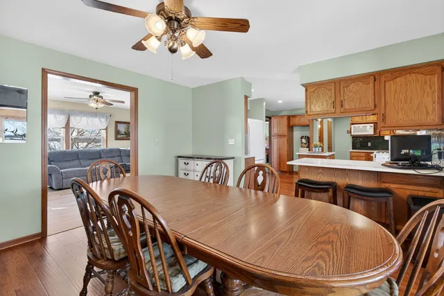 a dining room with furniture a window and a chandelier