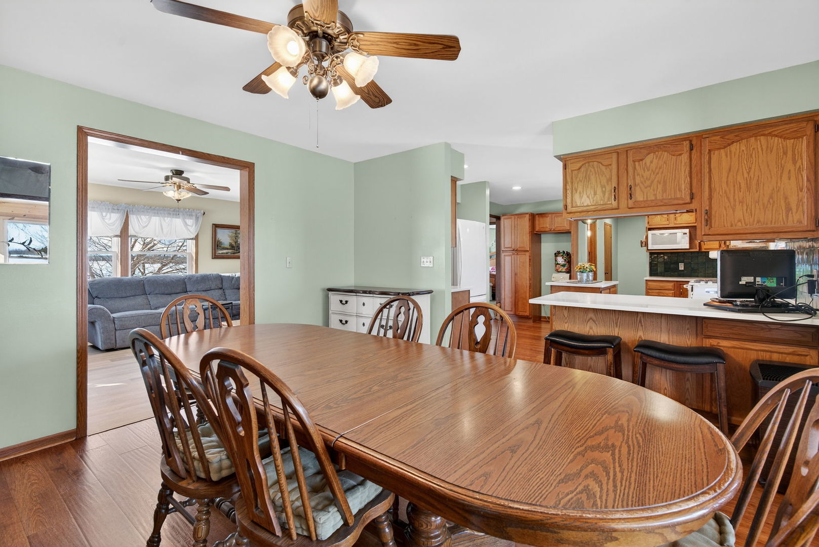 2420 North Dwight Road Morris, IL 60450 - Photo 12 of 38 a dining room with furniture a window and wooden floor