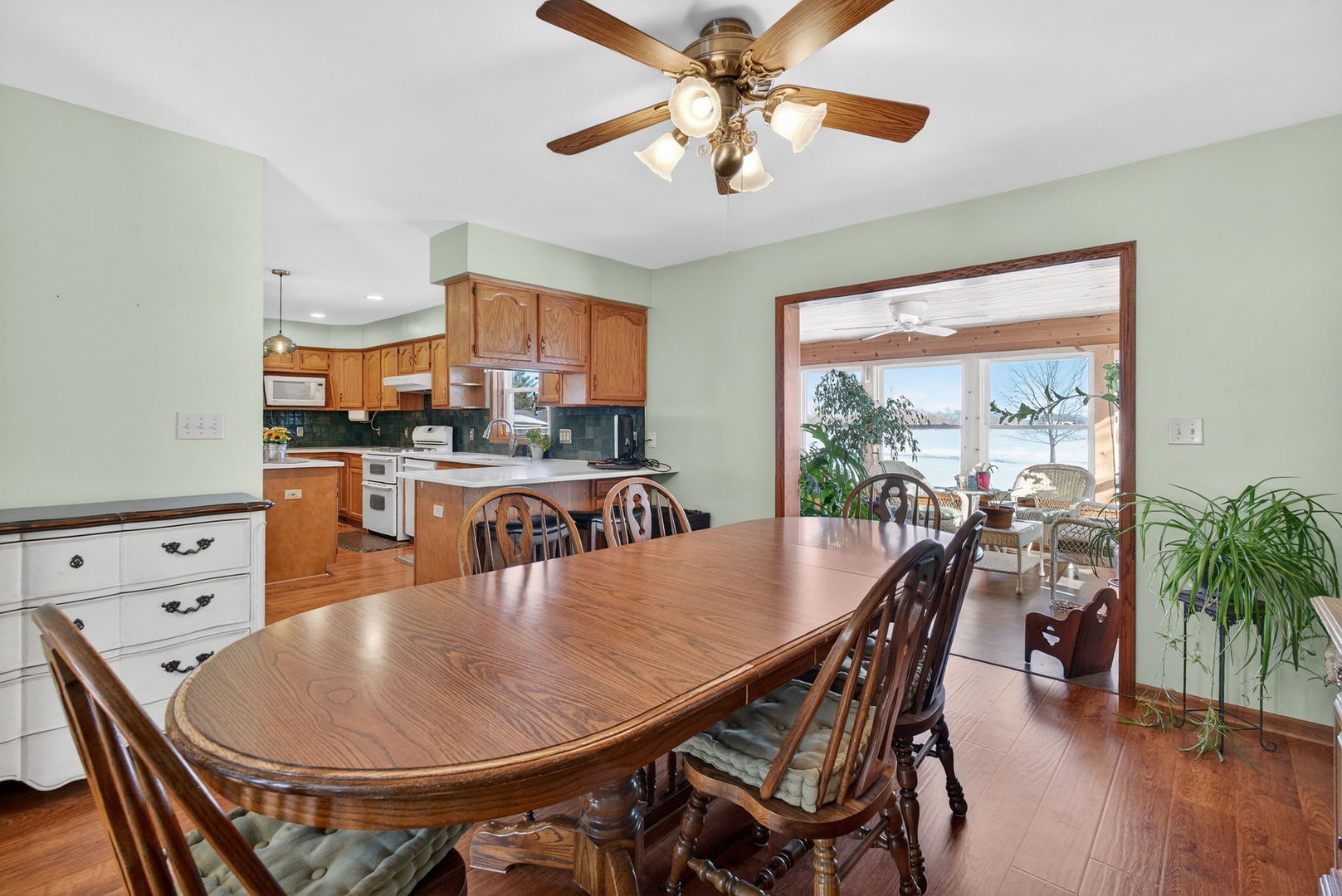 2420 North Dwight Road Morris, IL 60450 - Photo 13 of 38 a dining room with furniture a window and a chandelier