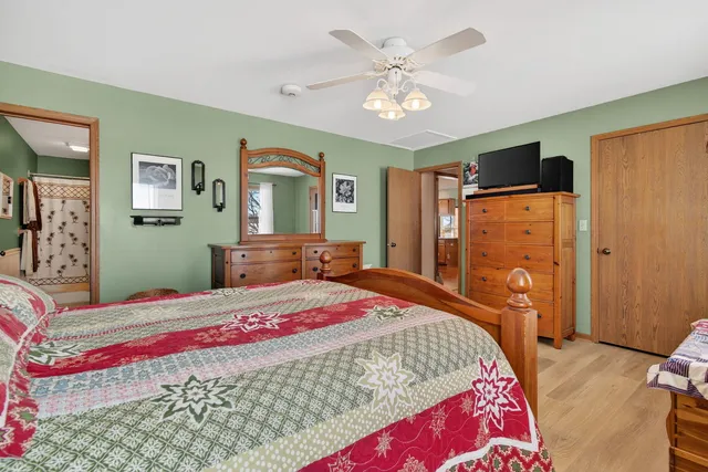 a bedroom with a bed and window