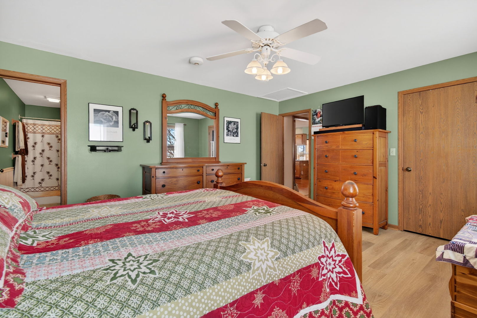 2420 North Dwight Road Morris, IL 60450 - Photo 19 of 38 a bedroom with a bed and a chandelier