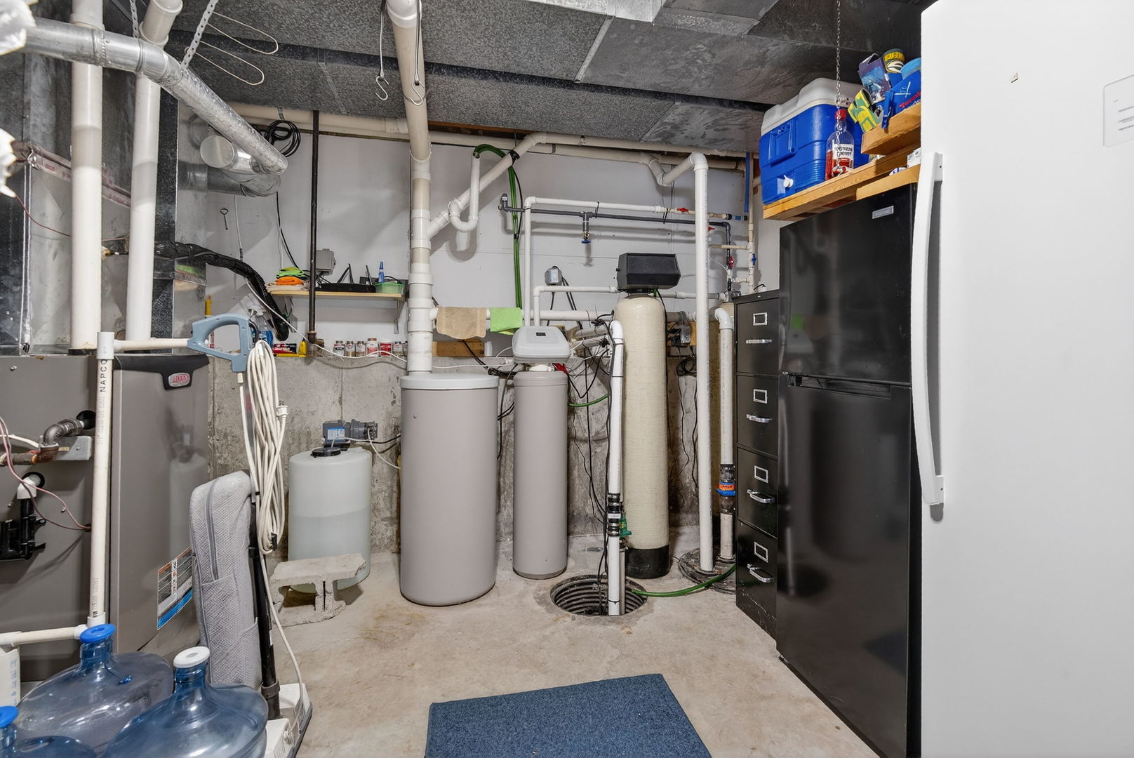 2420 North Dwight Road Morris, IL 60450 - Photo 27 of 38 a view of a storage room with water heater and racks