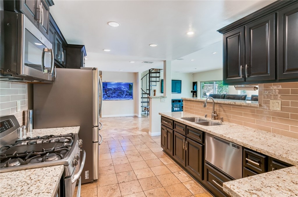 3403 Fallcreek Road Duarte, CA 91010 - Photo 22 of 69 a kitchen with stainless steel appliances granite countertop a stove a sink dishwasher and a refrigerator