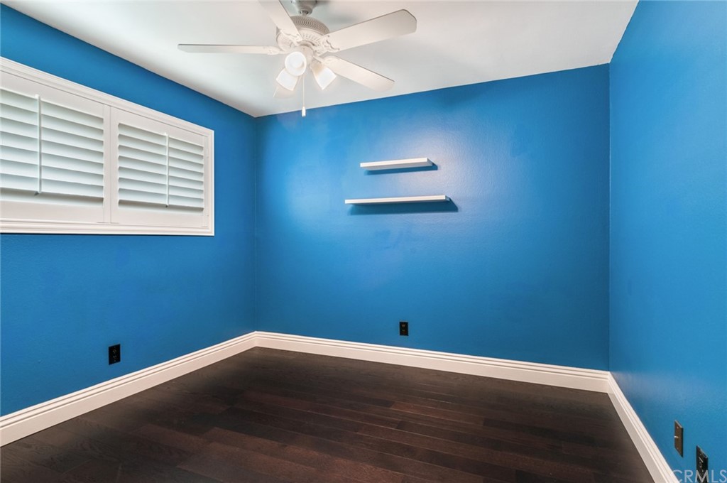 3403 Fallcreek Road Duarte, CA 91010 - Photo 61 of 69 an empty room with wooden floor fan and windows