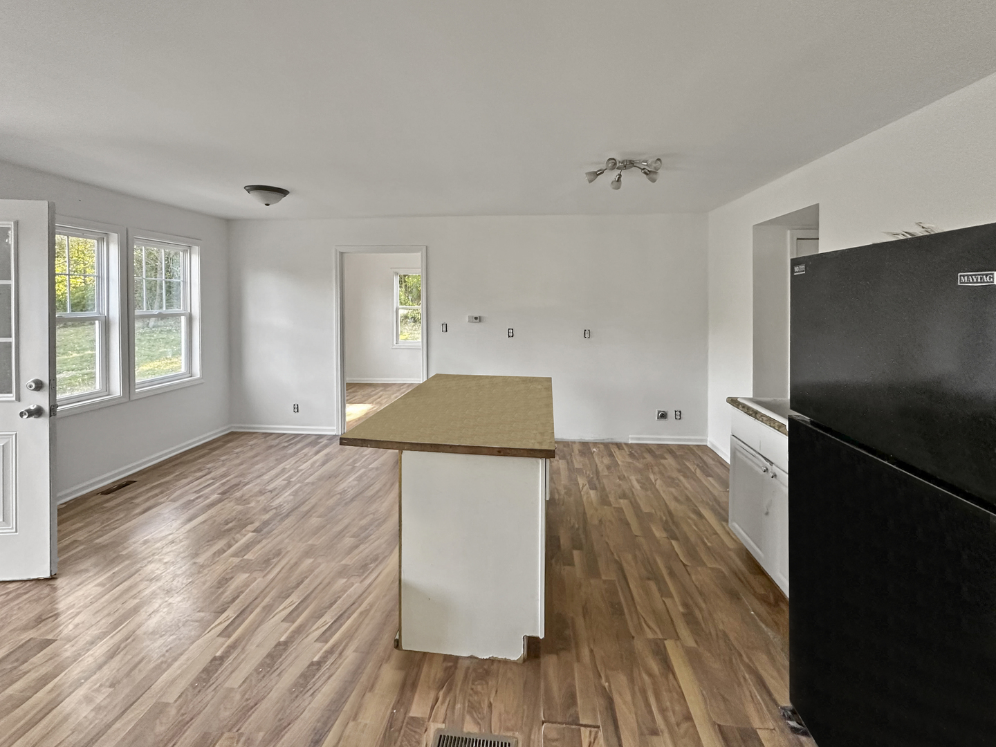 28611 Mall Road Ingleside, IL 60041 - Photo 3 of 7 a kitchen with a refrigerator and wooden floor