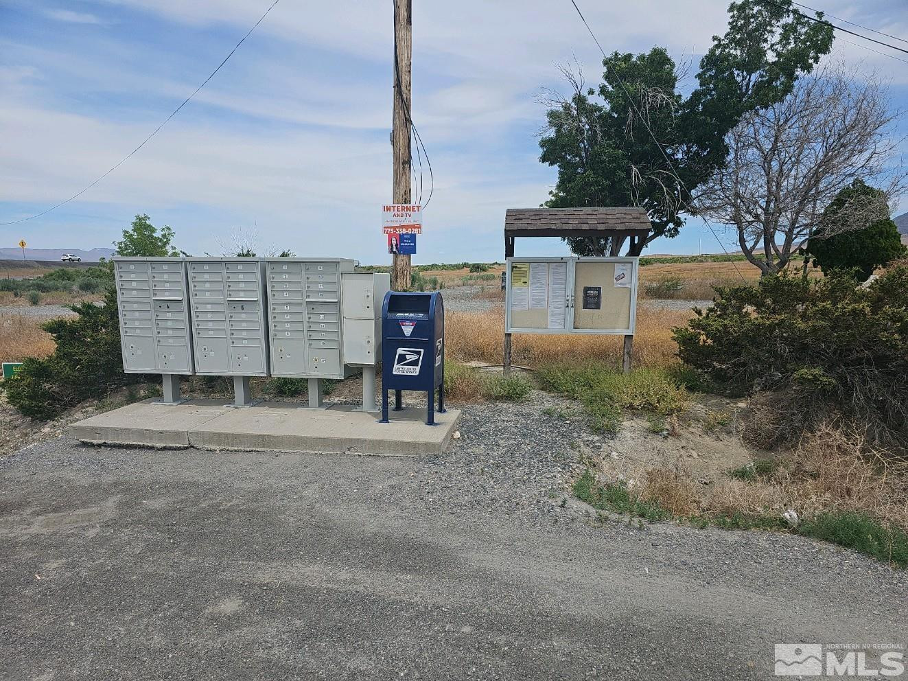 11385 New Exchequer Way, Unit 453 Lovelock, NV 89419 - Photo 3 of 12 a view of a house with a yard and garage
