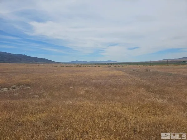 a view of an ocean beach and mountain