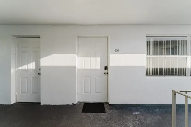 an empty room with wooden floor