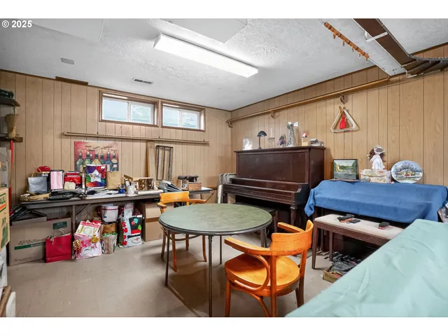 a living room with furniture a rug and a table