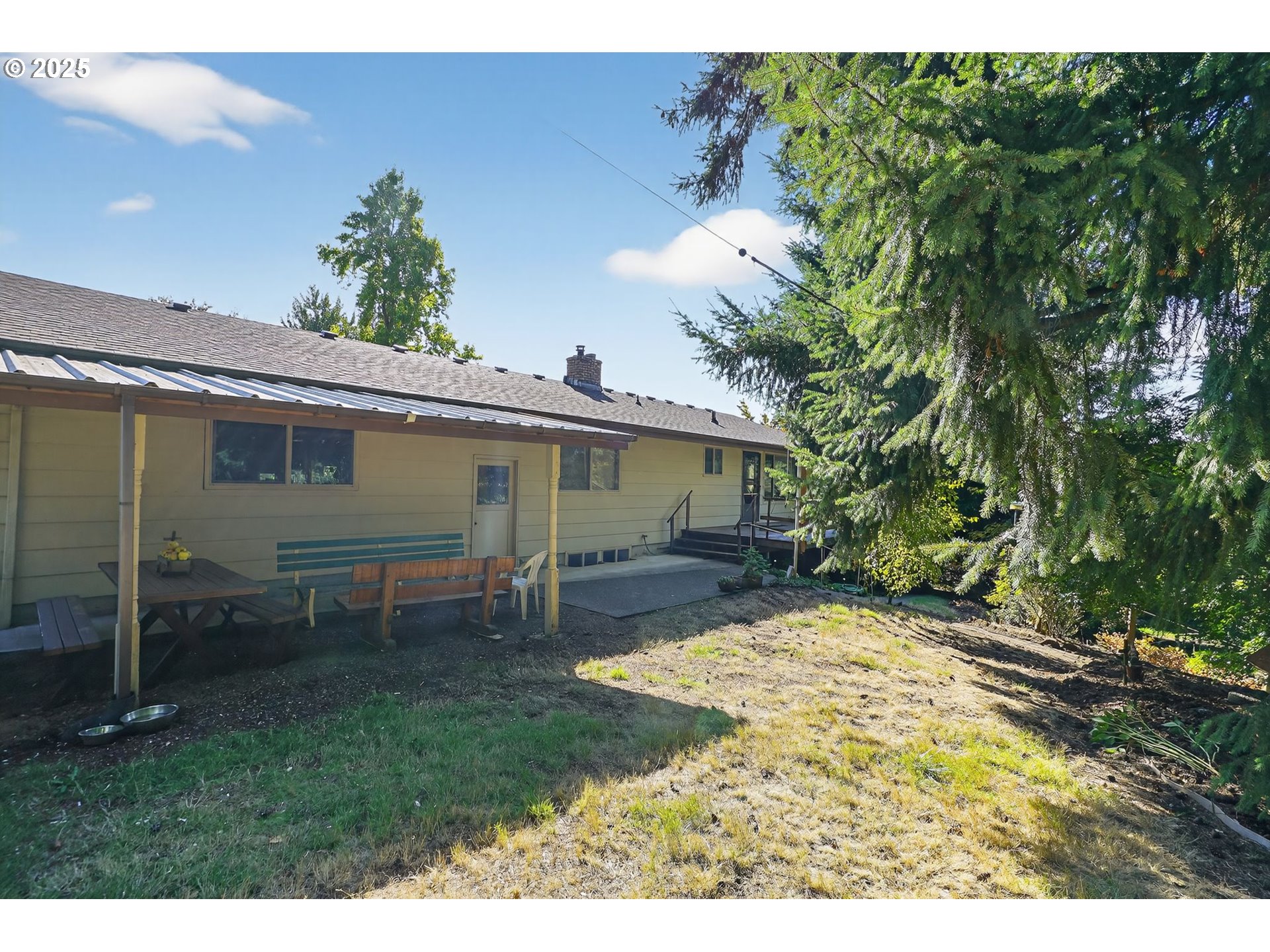 9479 Southeast Hillcrest Road Happy Valley, OR 97086 - Photo 23 of 30 a view of a backyard with table and chairs and potted plants