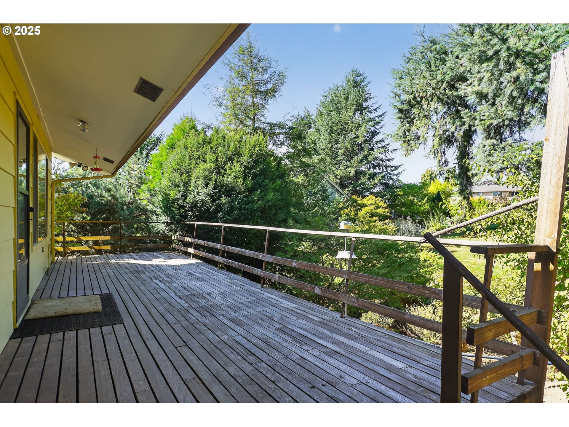 9479 Southeast Hillcrest Road Happy Valley, OR 97086 - Photo 25 of 30 a view of balcony with wooden floor and outdoor space