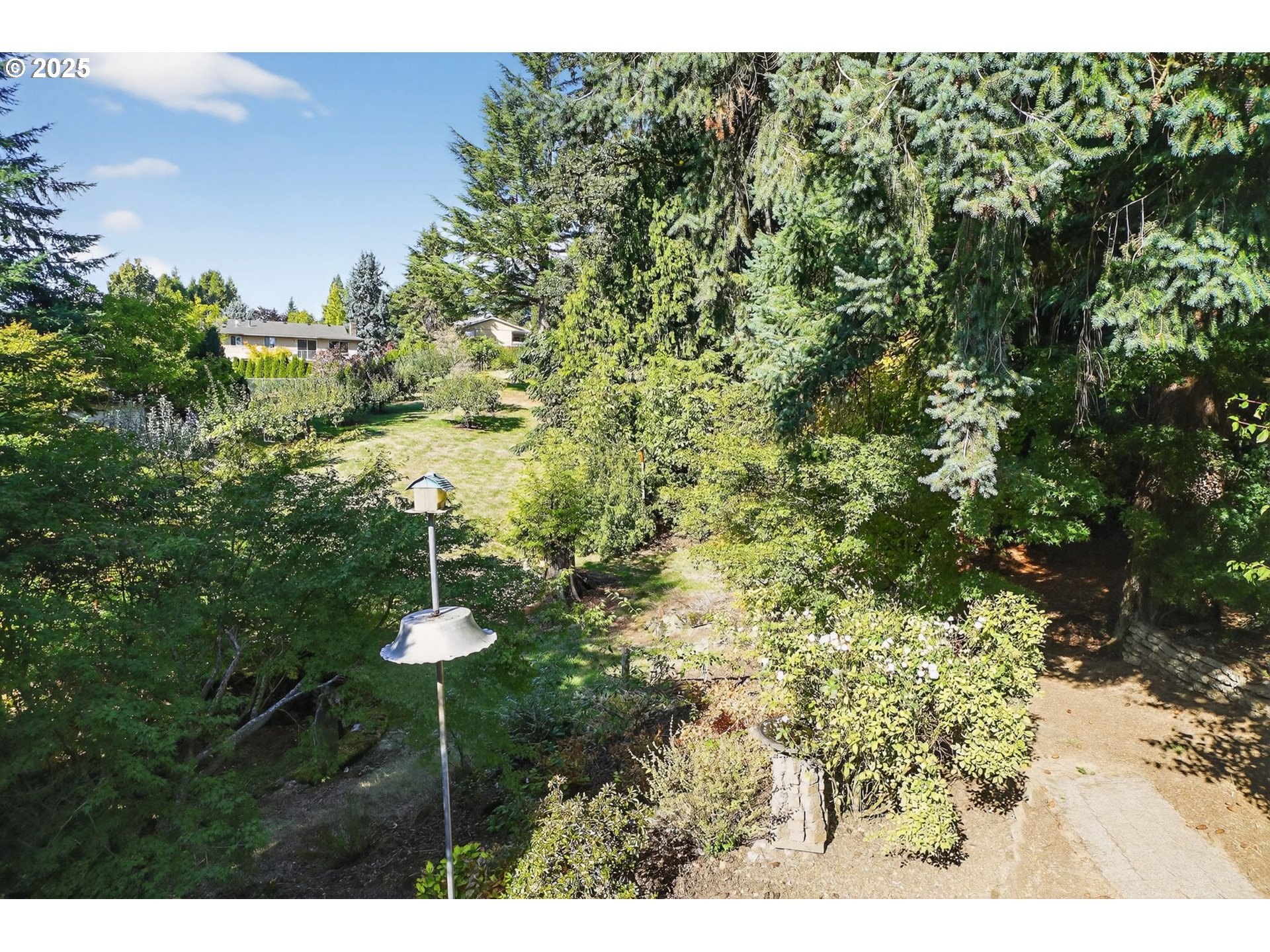 9479 Southeast Hillcrest Road Happy Valley, OR 97086 - Photo 29 of 30 a backyard of a house with a table and chair