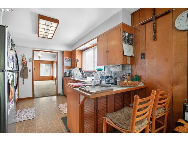 a kitchen view with appliances and cabinets