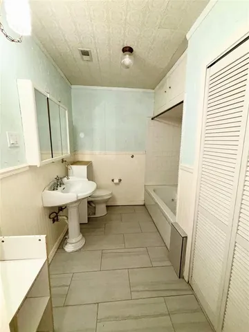 en empty room with windows and fan